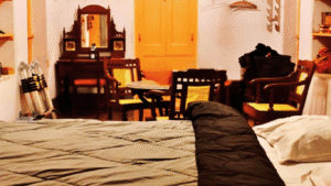 Spacious Heritage Family Suite with vintage furniture and multiple beds at Sett Heritage Residency